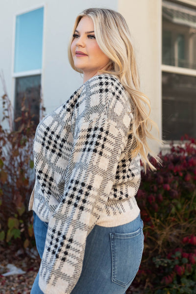 Side view of the plus size taupe button down cardigan