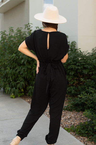 Back view of black jumpsuit with back closer