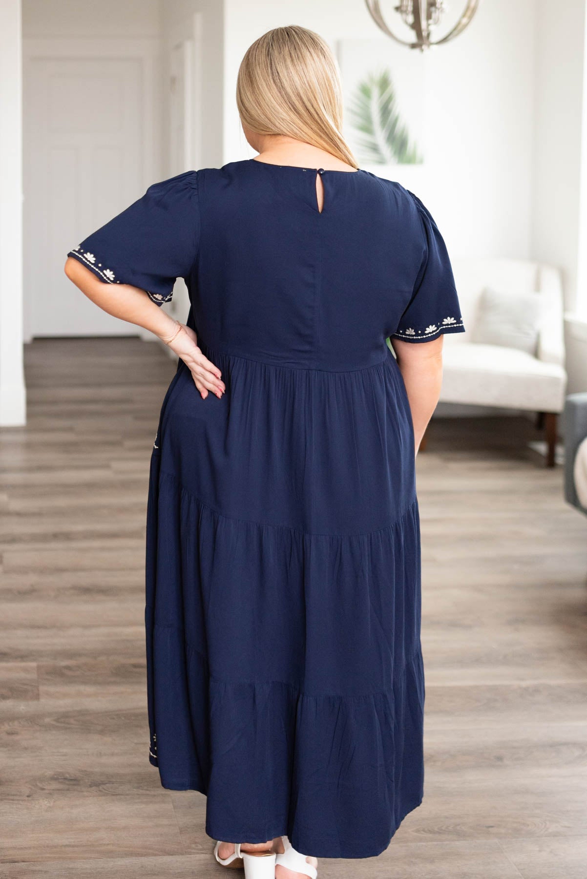Back view of the plus size navy embroidered dress