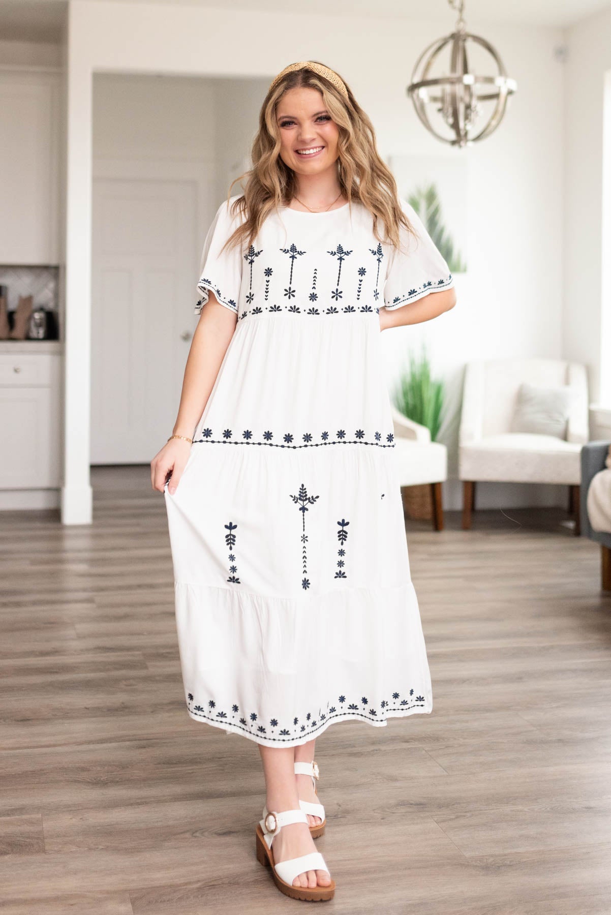 White embroidered dress with navy embroidered pattern