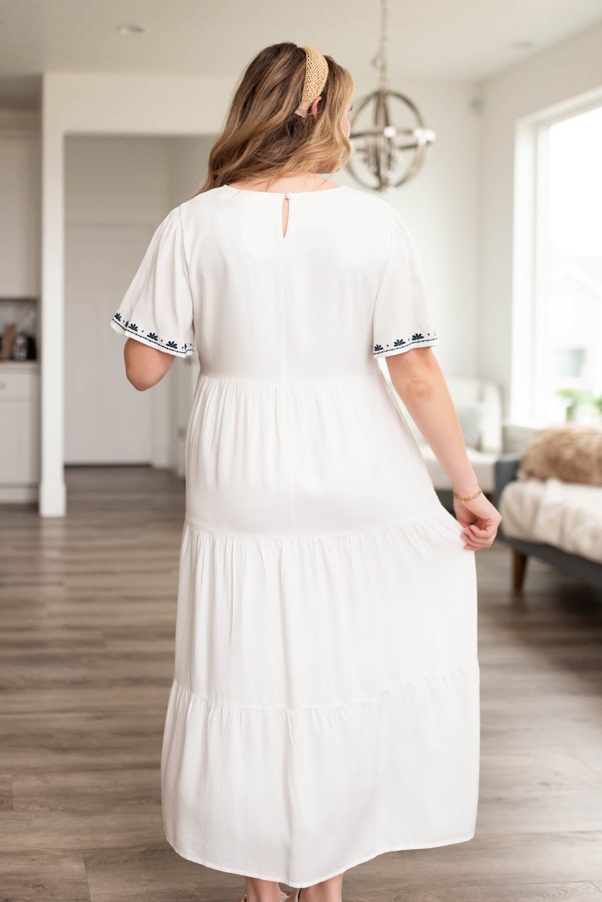 Back view of the white embroidered dress