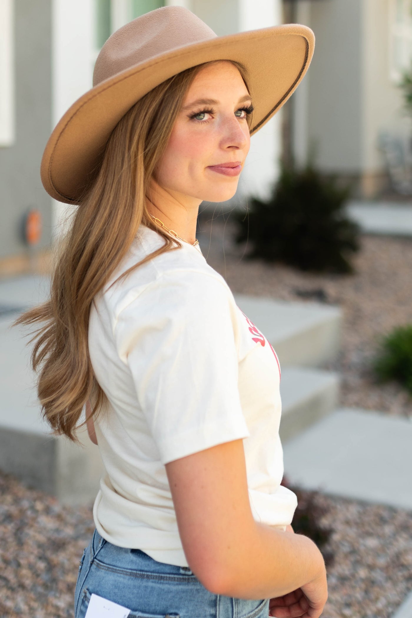Side view of long live cowgirls ivory tee