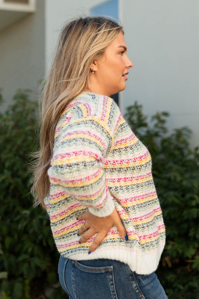 Side view of a striped sweater