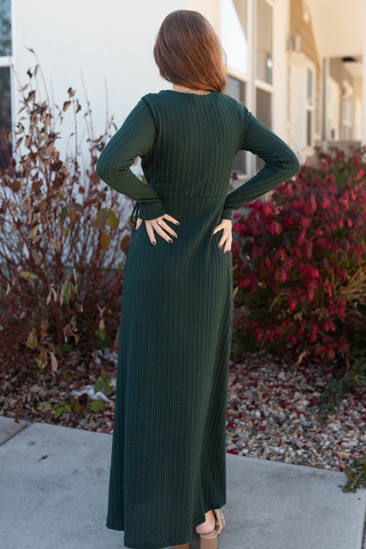 Back view of the hunter green textured maxi dress