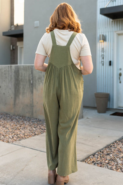 Back view of a plus size olive jumpsuit