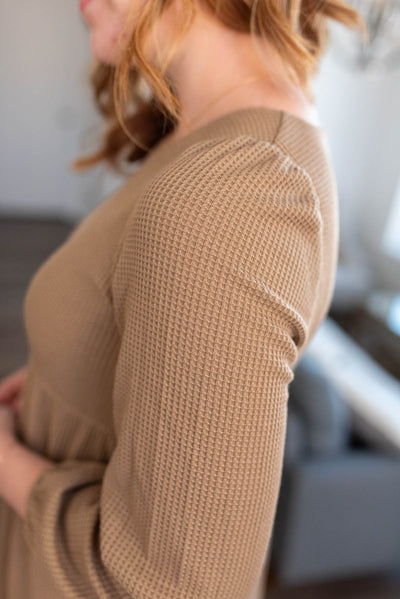 Sleeve of a mocha waffle knit dress