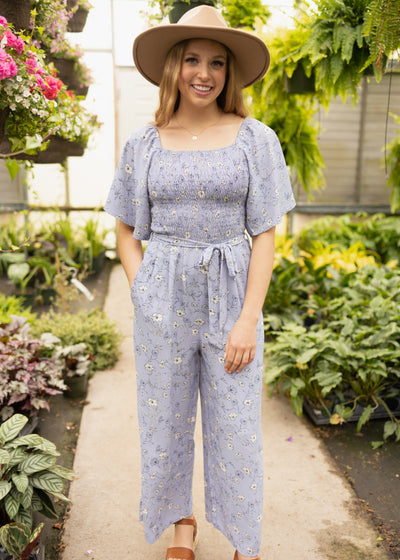 Short sleeve periwinkle jumpsuit with smocked bodice