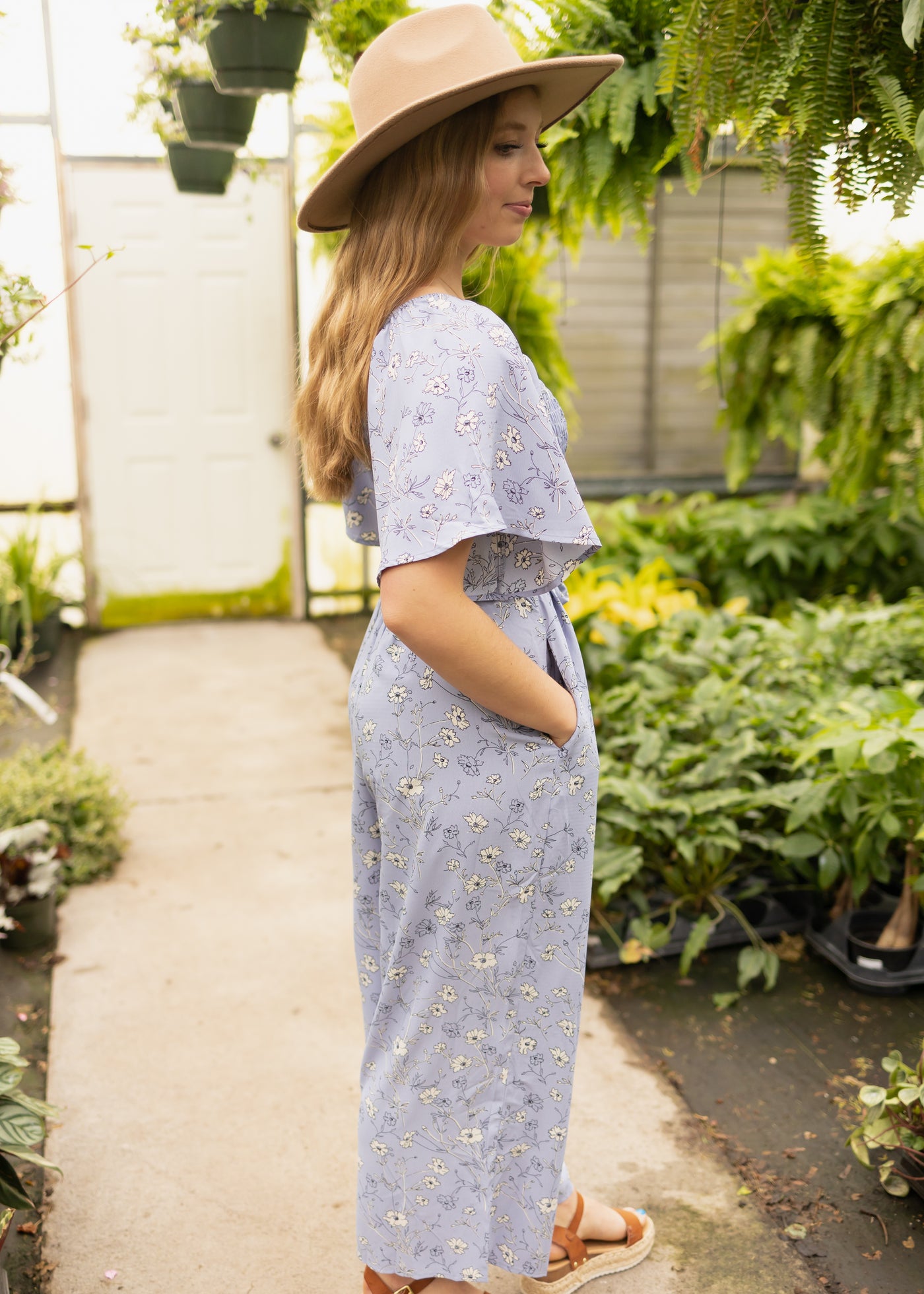 Side view of a periwinkle jumpsuit