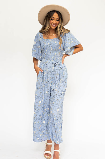 Periwinkle jumpsuit with floral pattern