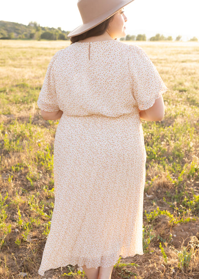 Back view of a plus size ivory floral dress