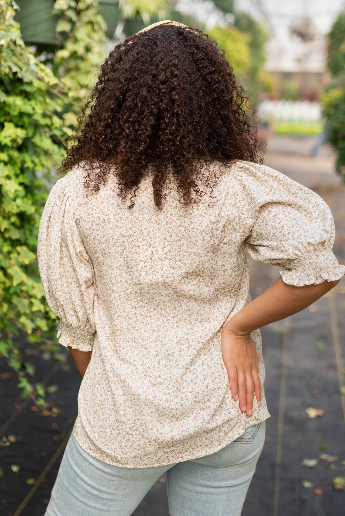 Back view of the taupe floral print top