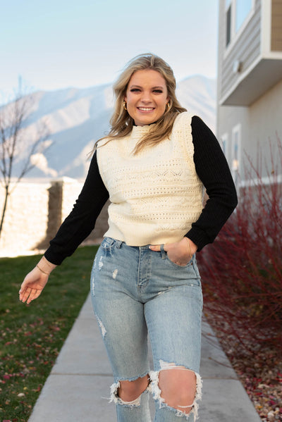 Ivory knit sweater vest with turtle neck
