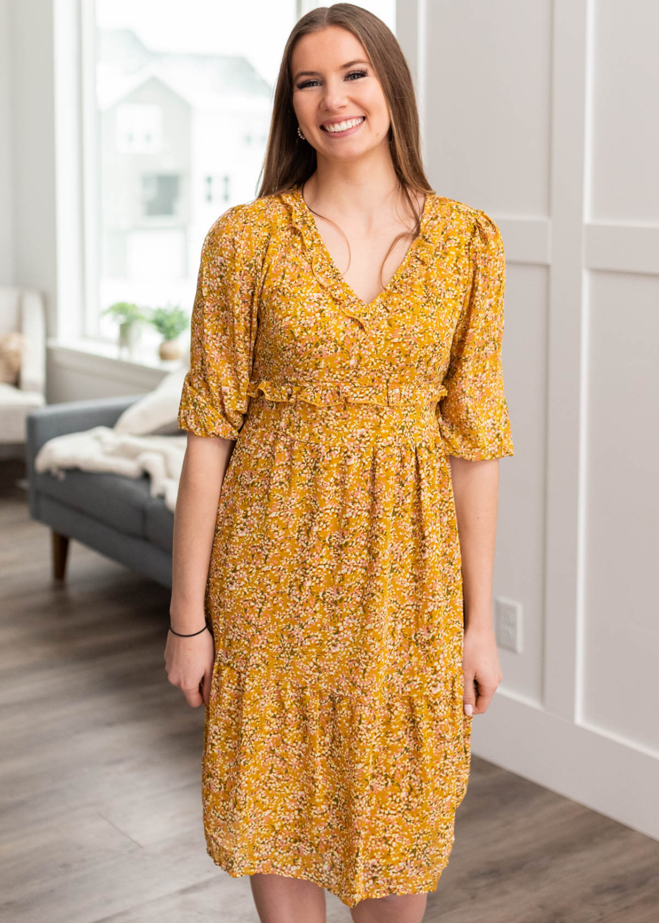 Short sleeve mustard floral dress with smocked bodice and v-neck
