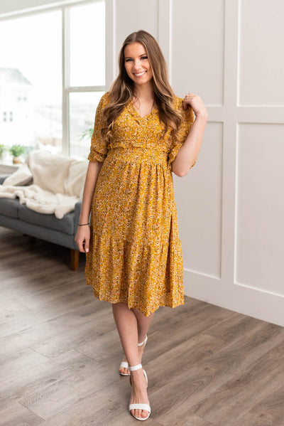 Short sleeve mustard floral dress with tired skirt and smocked bodice