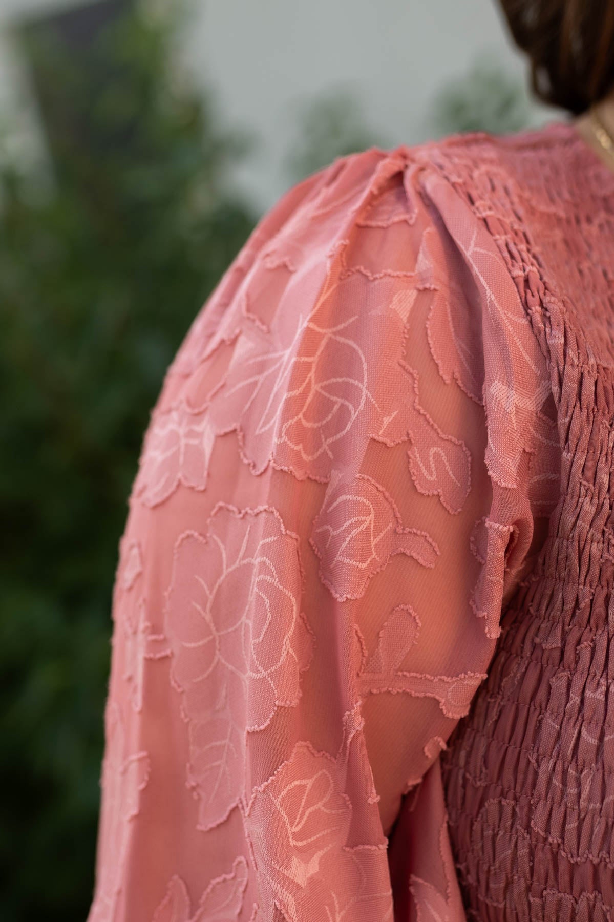 Fabric rose pattern of a dusty rose dress