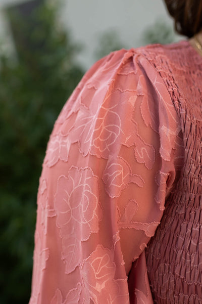 Fabric rose pattern of a dusty rose dress