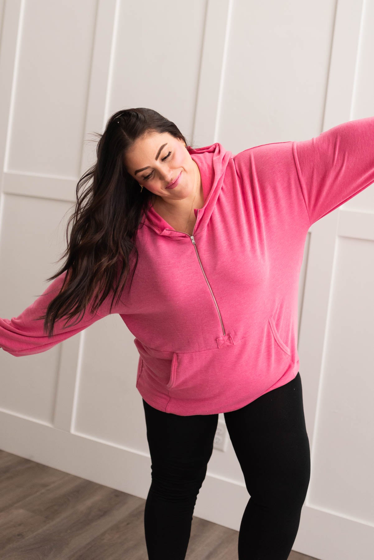 Plus size hot pink half zip pullover with a hood