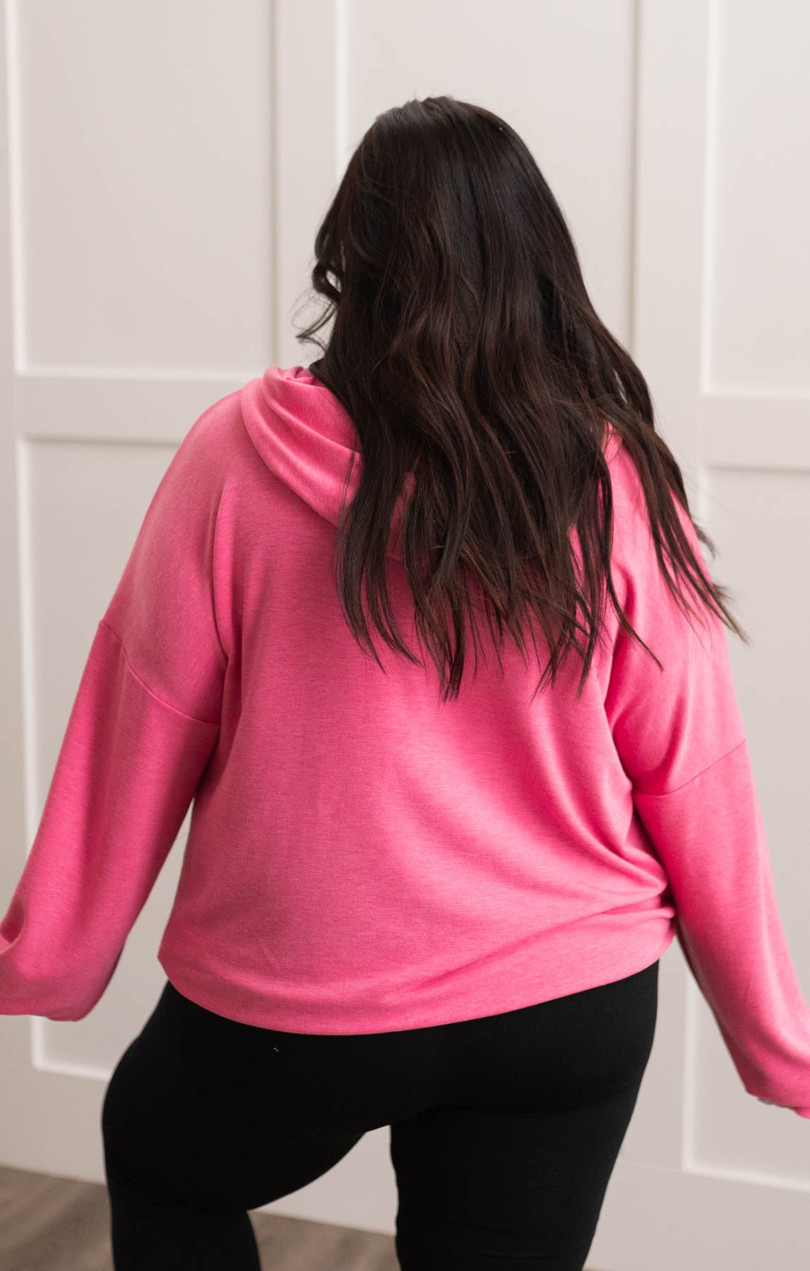 Back view of a plus size hot pink half zip pullover