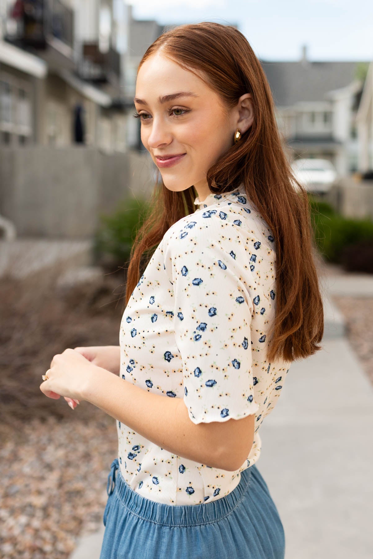 Side view of the cream floral top