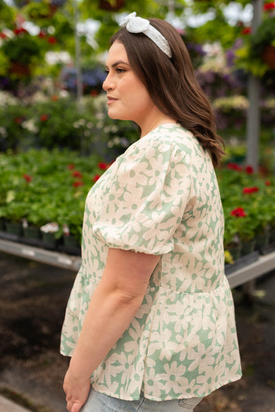 Side view of the plus size green floral blouse