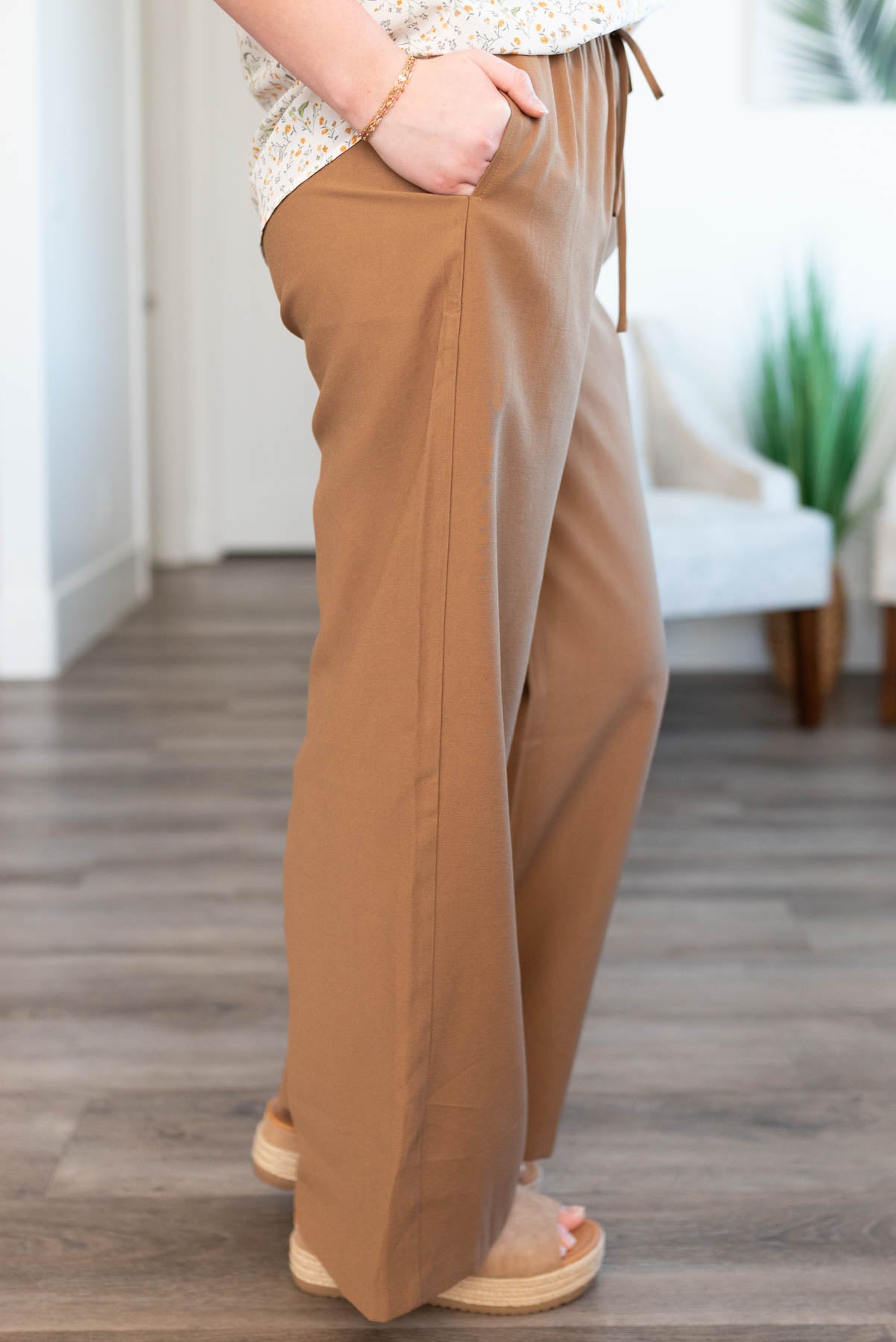 Side view of the brown wide leg pants