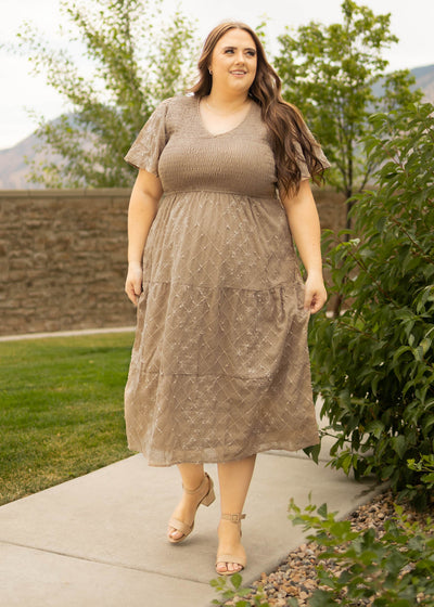 Plus size taupe dress with smocked bodice and v-neck