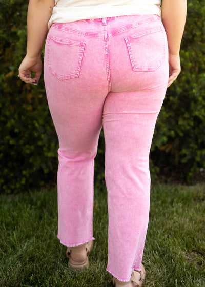 Back view of hot pink acid wash jeans