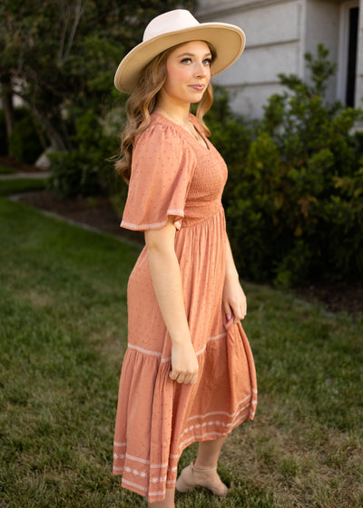 Side view of a short sleeve terracotta dress
