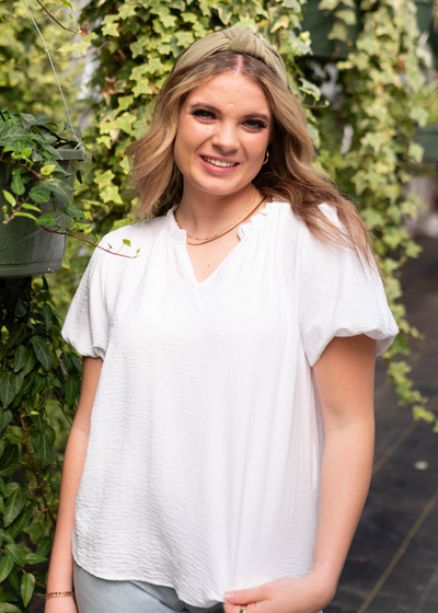 White ruffle blouse with short sleeves