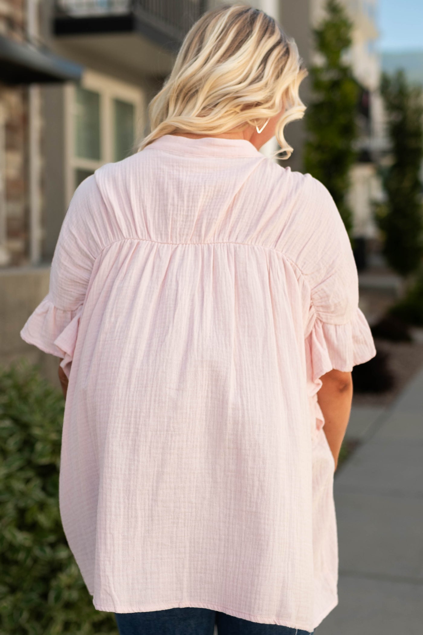 Back view of a blush top