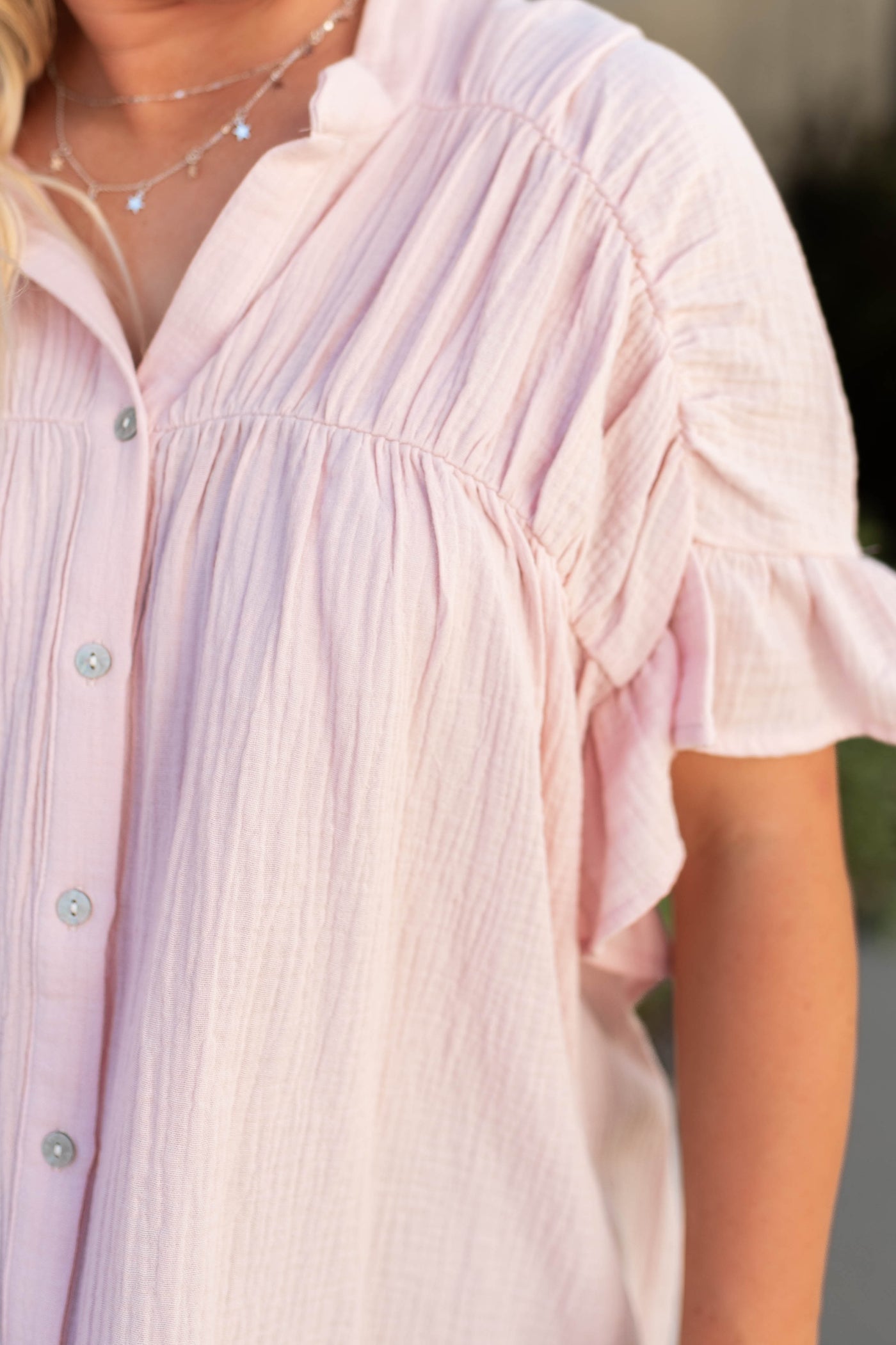 Sleeve of a short sleeve blush top