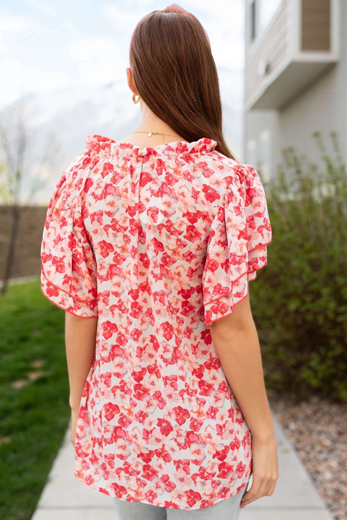 Back view of the pink floral ruffle blouse