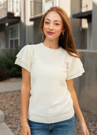 Short sleeve ivory top with ruffle sleeves