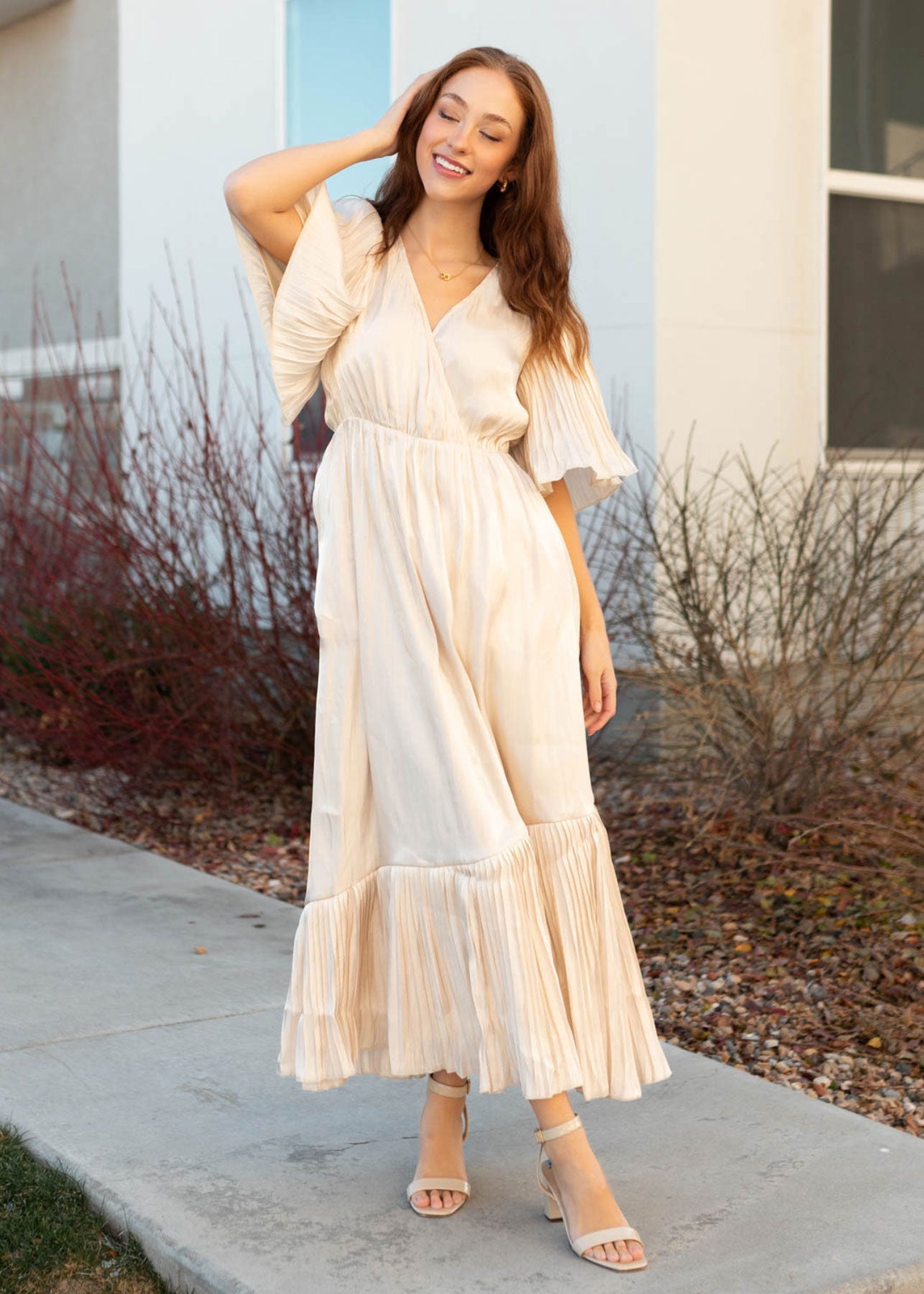Cream pleated wrap dress with elastic waist and short sleeves