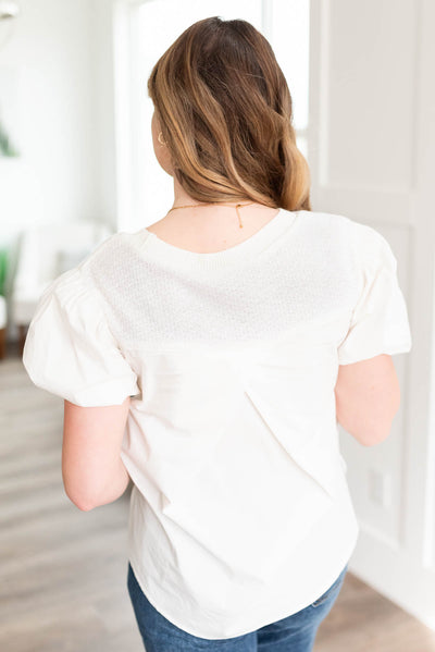 Back view of the off white blouse