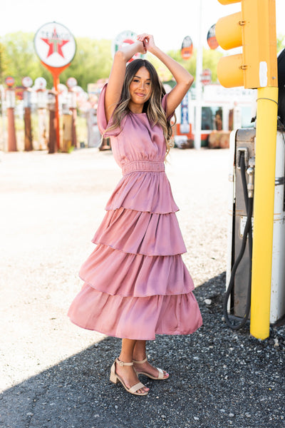 Satin mauve ruffle dress with short sleeves and elastic at the waist.