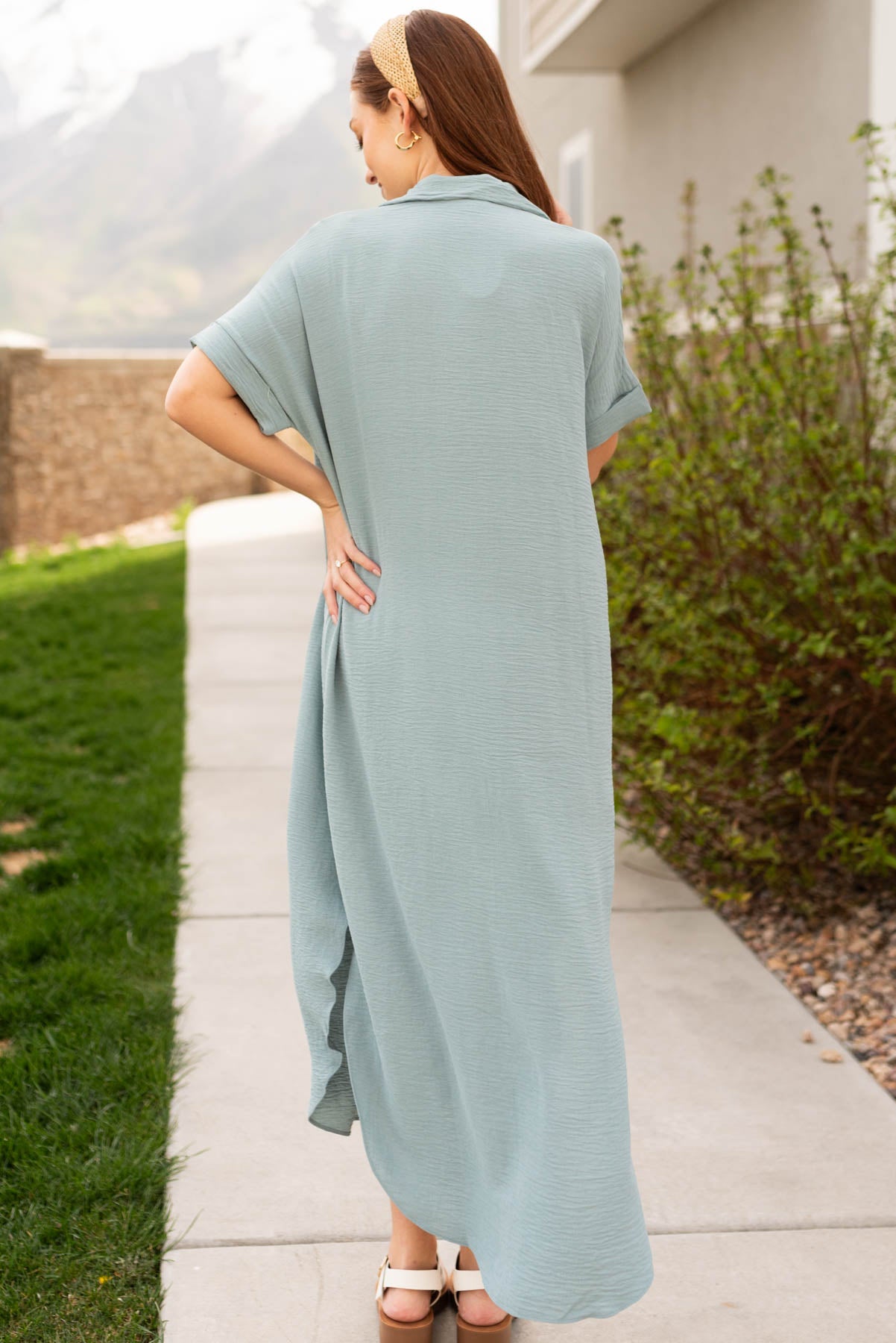 Back view of the sage blue button down dress