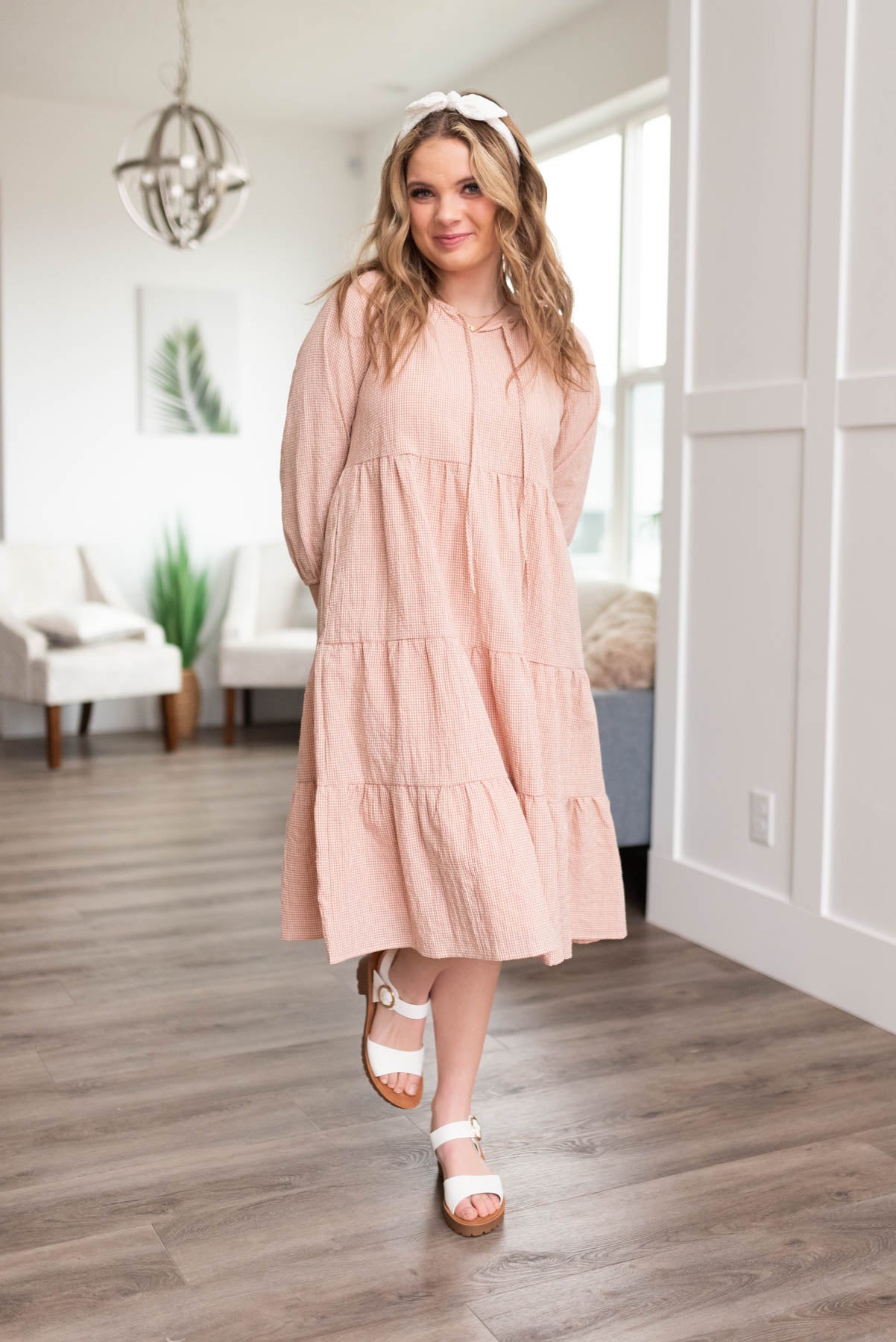 Blush tiered dress with long sleeves