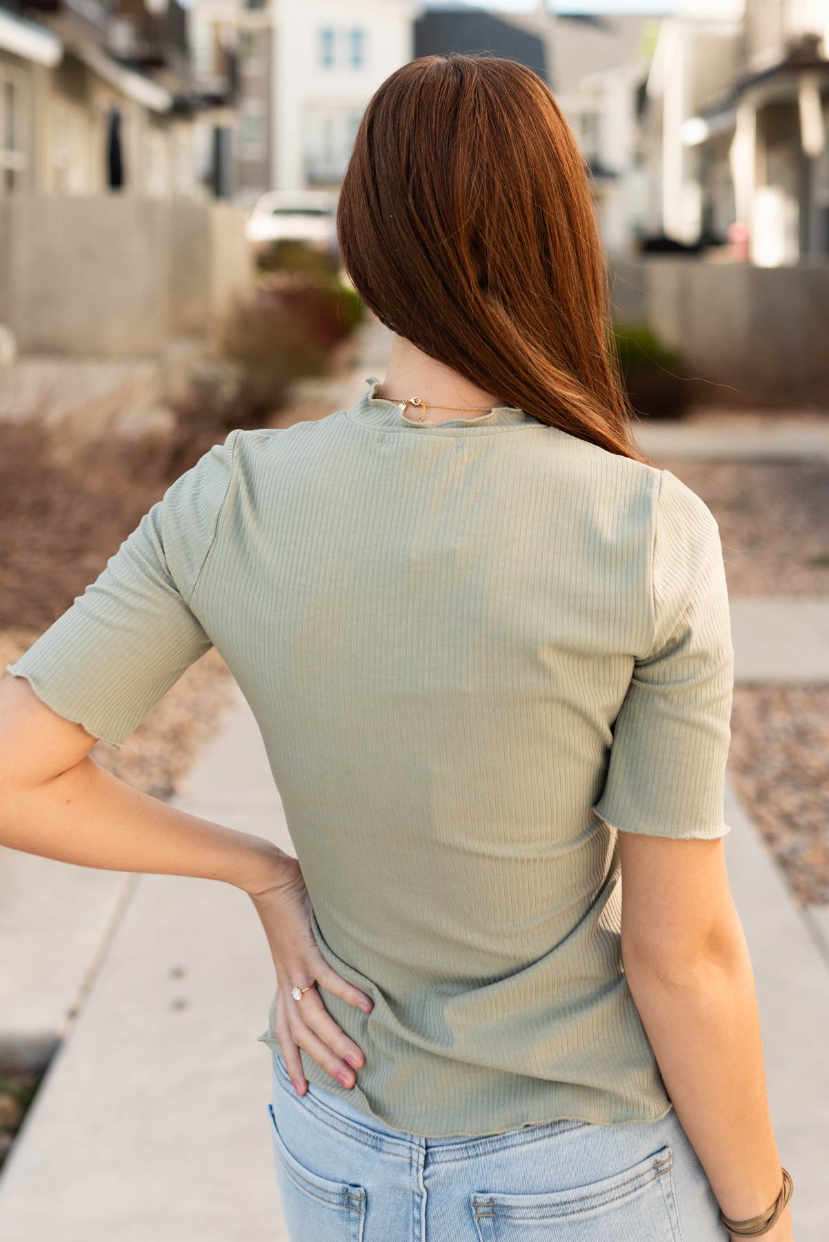 Back view of the sage textured knit top