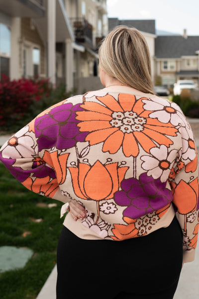 Back view of the plus size taupe floral sweater