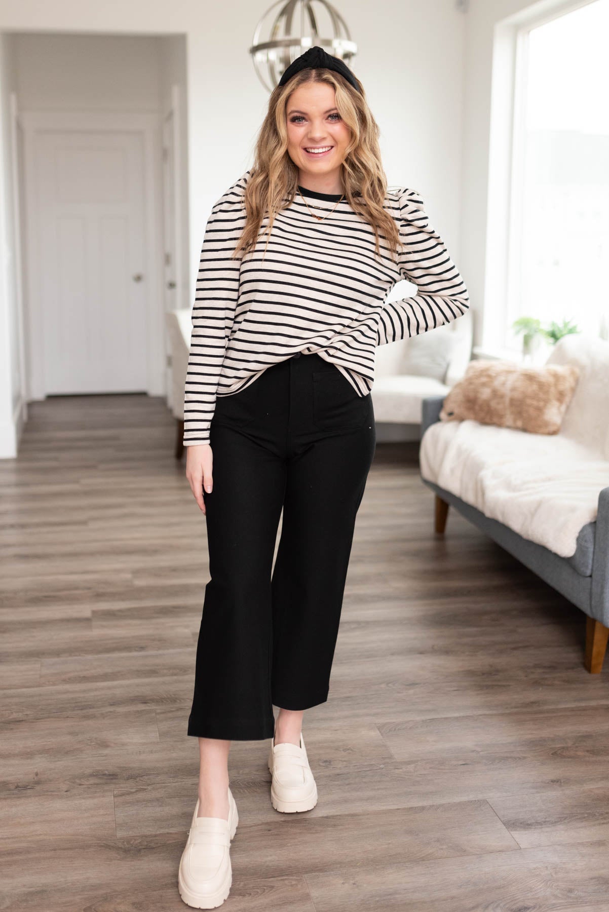 Black striped long sleeve top with gathers at the shoulders