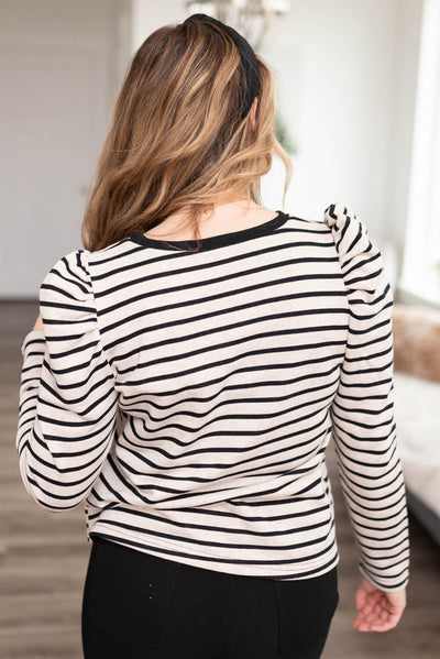 Back view of the black striped long sleeve top
