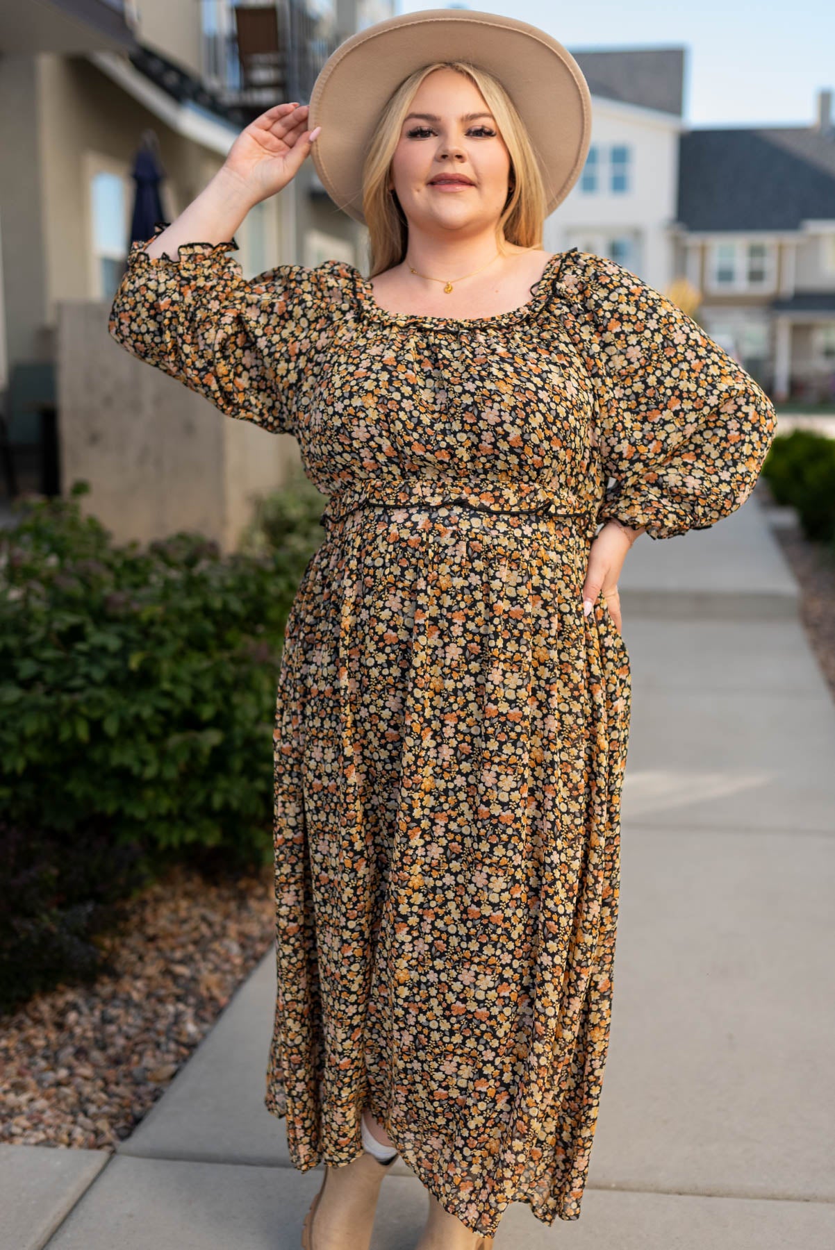 Long sleeve plus size black floral tiered dress with elastic waist