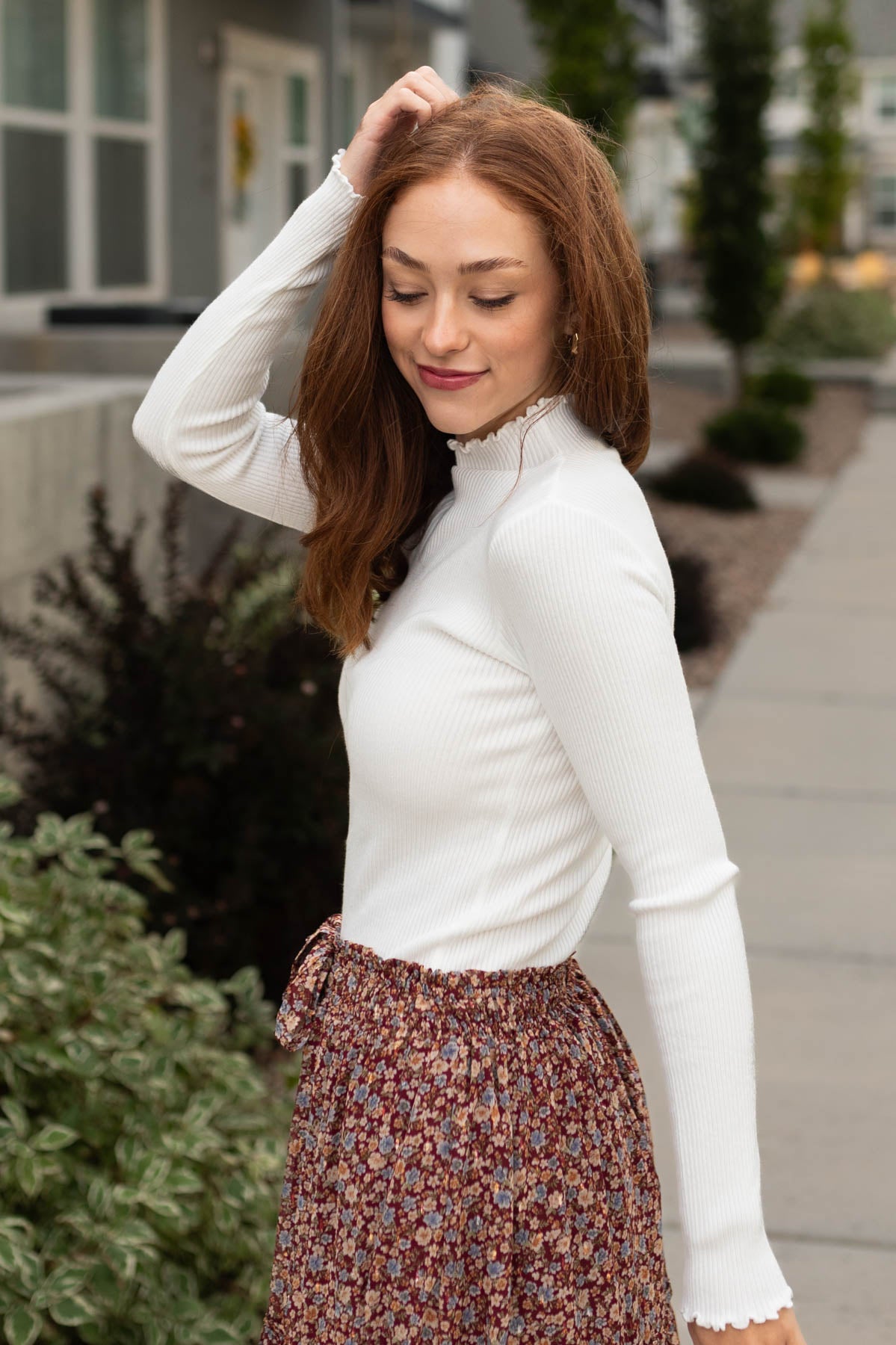 Side view of a white sweater