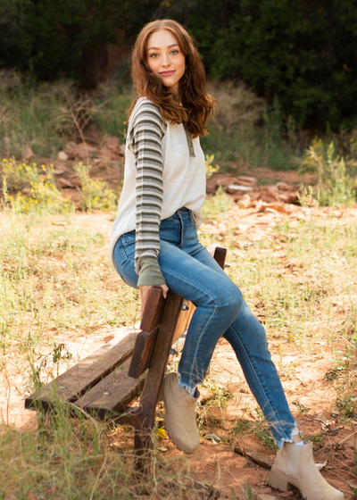 Long sleeve olive top with striped sleeves and ivory front