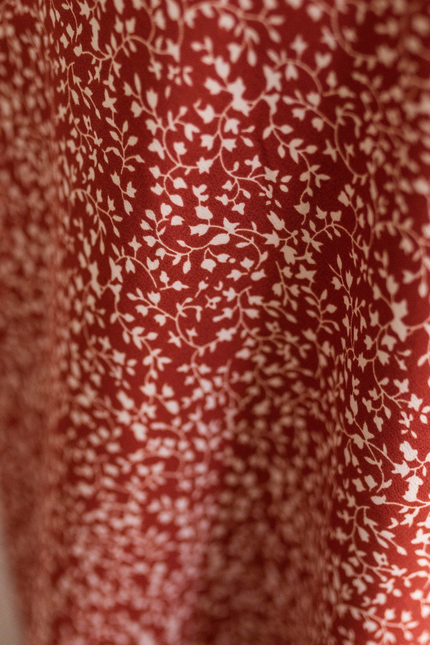 Floral pattern on the terracotta red floral skirt