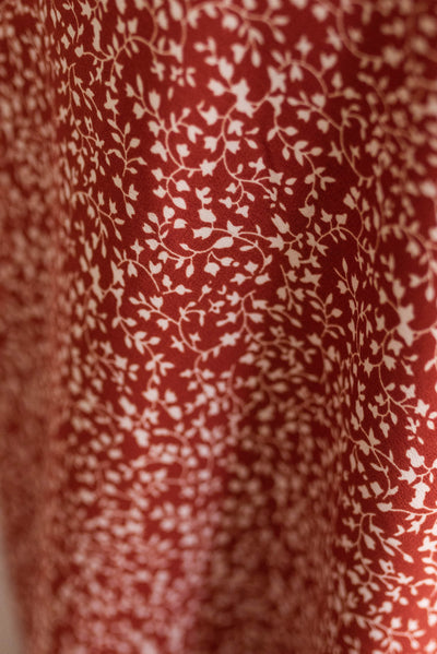 Floral pattern on the terracotta red floral skirt