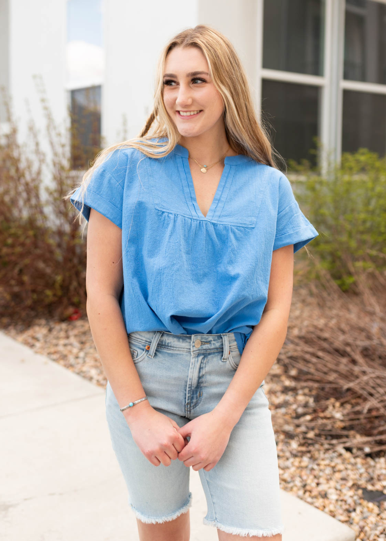 Blue v-neck top with short sleeves