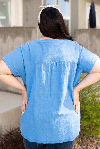 Back view of the plus size blue v-neck top