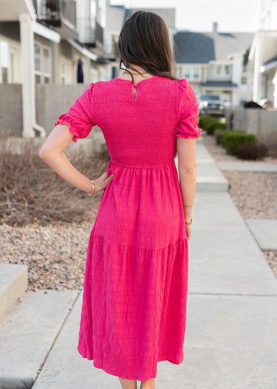 Back view of the hot pink tiered dress